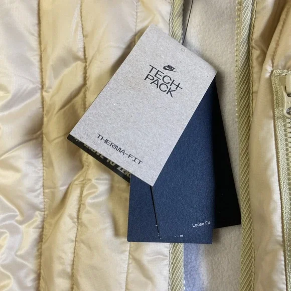NWT Woman Nike Therma-FIT Tech Pack Long Puffer Jacket Gold Sz S Reg $200